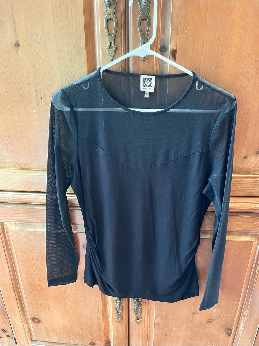 ANNE KLEIN. SOLID BLACK DRESSY TOP. SHEER BLACK UPPER BODICE, BACK,ARMS. MEDIUM